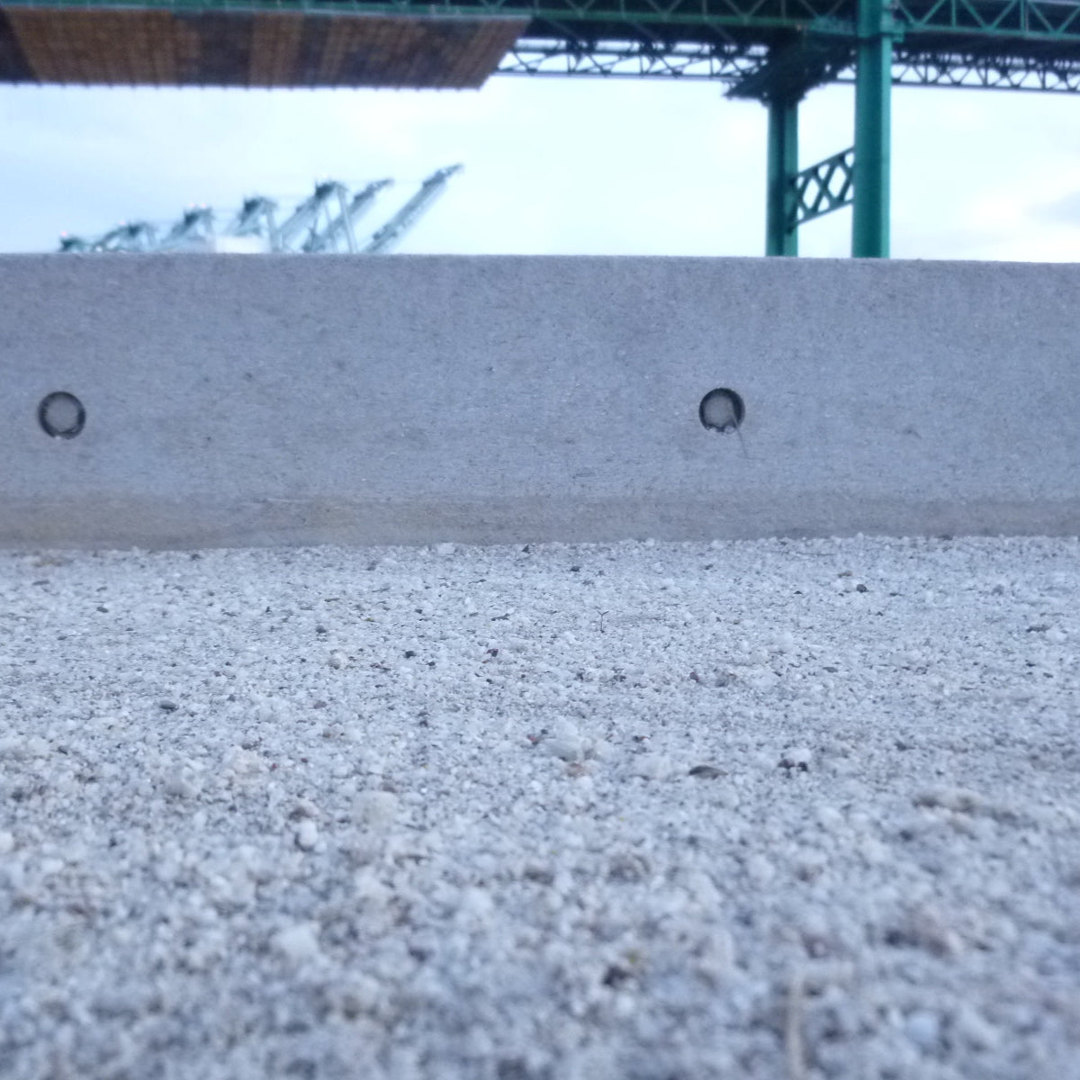 Closeup of a granite bocce court in an urban setting